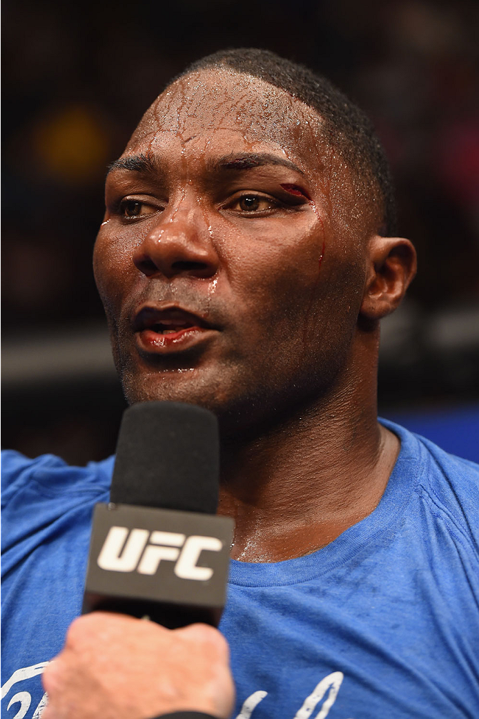 LAS VEGAS, NV - MAY 23:  Anthony Johnson speaks to Joe Rogan after his loss to Daniel Cormier in their UFC light heavyweight championship bout during the UFC 187 event at the MGM Grand Garden Arena on May 23, 2015 in Las Vegas, Nevada.  (Photo by Josh Hed