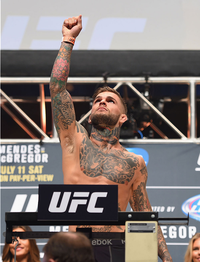 LAS VEGAS, NV - JULY 10:  Cody Garbrandt steps onto the scale during the UFC 189 weigh-in inside MGM Grand Garden Arena on July 10, 2015 in Las Vegas, Nevada.  (Photo by Josh Hedges/Zuffa LLC/Zuffa LLC via Getty Images)