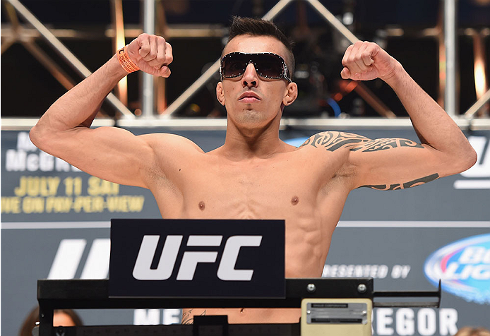 LAS VEGAS, NV - JULY 10:  Thomas Almeida steps onto the scale during the UFC 189 weigh-in inside MGM Grand Garden Arena on July 10, 2015 in Las Vegas, Nevada.  (Photo by Josh Hedges/Zuffa LLC/Zuffa LLC via Getty Images)