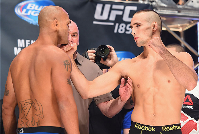 LAS VEGAS, NV - JULY 10:  (L-R) UFC welterweight champion Robbie Lawler and Rory Macdonald face off steps onto the scale during the UFC 189 weigh-in inside MGM Grand Garden Arena on July 10, 2015 in Las Vegas, Nevada.  (Photo by Josh Hedges/Zuffa LLC/Zuff