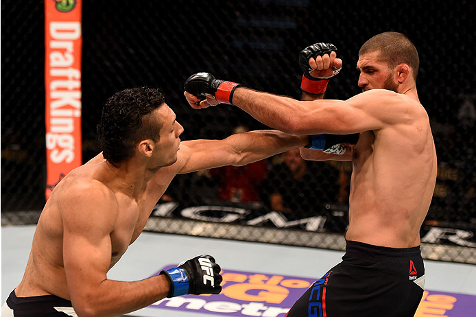 LAS VEGAS, NV - DECEMBER 12: (L-R) Marcio Alexandre of Brazil punches Court McGee in their welterweight bout during the UFC 194 event inside MGM Grand Garden Arena on December 12, 2015 in Las Vegas, Nevada.  (Photo by Josh Hedges/Zuffa LLC/Zuffa LLC via G