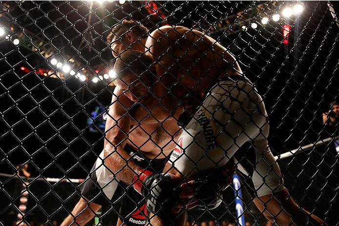 LAS VEGAS, NV - DECEMBER 12: Marcio Alexandre of Brazil (white trunks) grapples with Court McGee in their welterweight bout during the UFC 194 event inside MGM Grand Garden Arena on December 12, 2015 in Las Vegas, Nevada. (Photo by Christian Petersen/Zuf