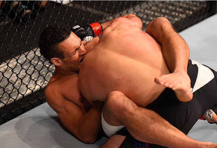 LAS VEGAS, NV - DECEMBER 12: Marcio Alexandre of Brazil (left) attempts to submit Court McGee in their welterweight bout during the UFC 194 event inside MGM Grand Garden Arena on December 12, 2015 in Las Vegas, Nevada. (Photo by Josh Hedges/Zuffa LLC/Zuf