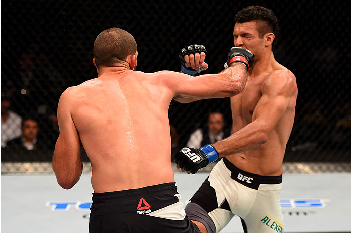 LAS VEGAS, NV - DECEMBER 12: (L-R) Court McGee punches Marcio Alexandre of Brazil in their welterweight bout during the UFC 194 event inside MGM Grand Garden Arena on December 12, 2015 in Las Vegas, Nevada.  (Photo by Josh Hedges/Zuffa LLC/Zuffa LLC via G