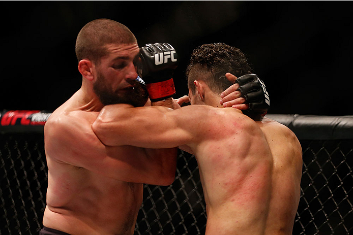 LAS VEGAS, NV - DECEMBER 12: (L-R) Court McGee elbows Marcio Alexandre of Brazil in their welterweight bout during the UFC 194 event inside MGM Grand Garden Arena on December 12, 2015 in Las Vegas, Nevada. (Photo by Christian Petersen/Zuffa LLC/Zuffa LLC