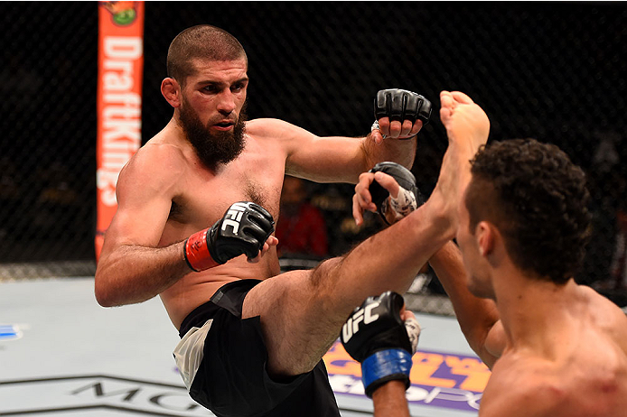 LAS VEGAS, NV - DECEMBER 12: (L-R) Court McGee kicks Marcio Alexandre of Brazil in their welterweight bout during the UFC 194 event inside MGM Grand Garden Arena on December 12, 2015 in Las Vegas, Nevada. (Photo by Josh Hedges/Zuffa LLC/Zuffa LLC via Get