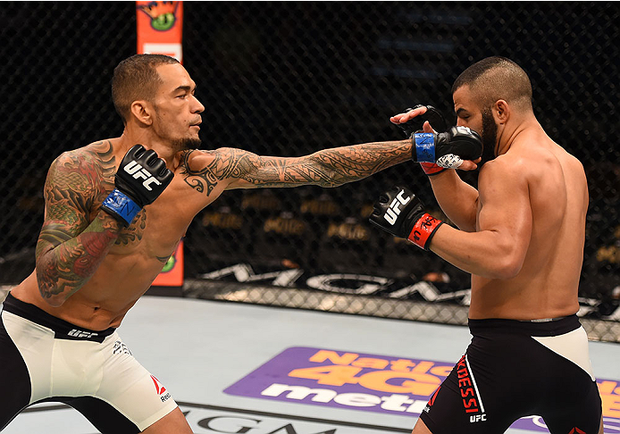 LAS VEGAS, NV - DECEMBER 12: (L-R) Yancy Medeiros punches John Makedssi of Canada in their lightweight bout during the UFC 194 event inside MGM Grand Garden Arena on December 12, 2015 in Las Vegas, Nevada. (Photo by Josh Hedges/Zuffa LLC/Zuffa LLC via Ge