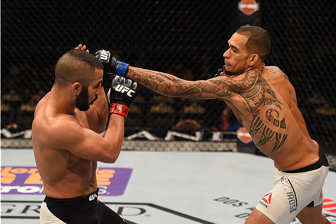 LAS VEGAS, NV - DECEMBER 12: (R-L) Yancy Medeiros punches John Makedssi of Canada in their lightweight bout during the UFC 194 event inside MGM Grand Garden Arena on December 12, 2015 in Las Vegas, Nevada. (Photo by Josh Hedges/Zuffa LLC/Zuffa LLC via Ge