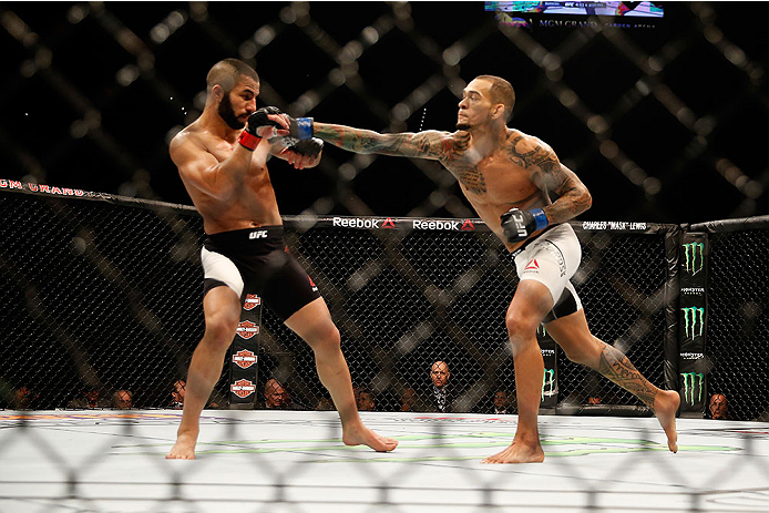 LAS VEGAS, NV - DECEMBER 12: (R-L) Yancy Medeiros punches John Makedssi of Canada in their lightweight bout during the UFC 194 event inside MGM Grand Garden Arena on December 12, 2015 in Las Vegas, Nevada.  (Photo by Christian Petersen/Zuffa LLC/Zuffa LLC