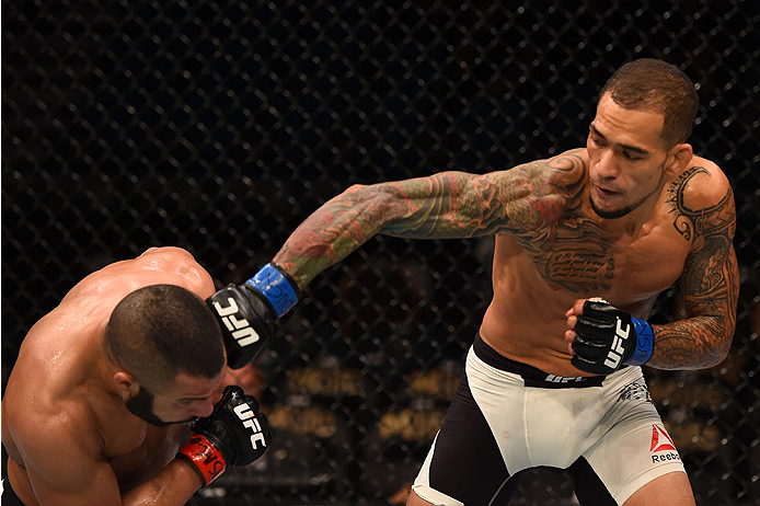LAS VEGAS, NV - DECEMBER 12: (R-L) Yancy Medeiros punches John Makedssi of Canada in their lightweight bout during the UFC 194 event inside MGM Grand Garden Arena on December 12, 2015 in Las Vegas, Nevada. (Photo by Josh Hedges/Zuffa LLC/Zuffa LLC via Ge