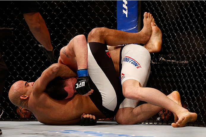 LAS VEGAS, NV - DECEMBER 12: (L-R) Warlley Alves of Brazil attempts to submit Colby Covington in their welterweight bout during the UFC 194 event inside MGM Grand Garden Arena on December 12, 2015 in Las Vegas, Nevada. (Photo by Christian Petersen/Zuffa