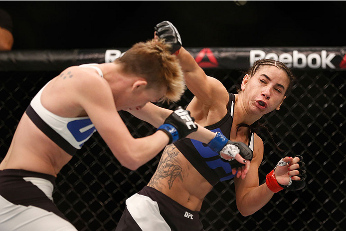 LAS VEGAS, NV - DECEMBER 12: (R-L) Tecia Torres punches Jocelyn Jones-Lybarger in their women's strawweight bout during the UFC 194 event inside MGM Grand Garden Arena on December 12, 2015 in Las Vegas, Nevada.  (Photo by Christian Petersen/Zuffa LLC/Zuff