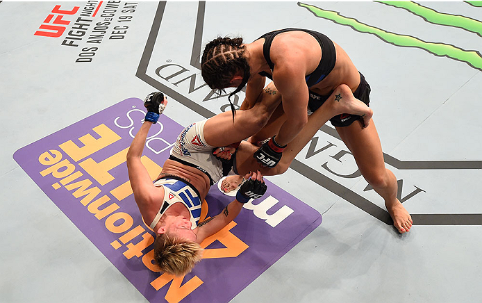 LAS VEGAS, NV - DECEMBER 12: Tecia Torres (top) grapples with Jocelyn Jones-Lybarger in their women's strawweight bout during the UFC 194 event inside MGM Grand Garden Arena on December 12, 2015 in Las Vegas, Nevada.  (Photo by Josh Hedges/Zuffa LLC/Zuffa