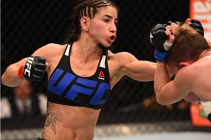 LAS VEGAS, NV - DECEMBER 12: (L-R) Tecia Torres punches Jocelyn Jones-Lybarger in their women's strawweight bout during the UFC 194 event inside MGM Grand Garden Arena on December 12, 2015 in Las Vegas, Nevada. (Photo by Josh Hedges/Zuffa LLC/Zuffa LLC