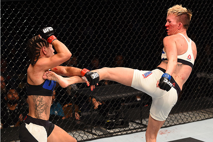 LAS VEGAS, NV - DECEMBER 12: (R-L) Jocelyn Jones-Lybarger kicks Tecia Torres in their women's strawweight bout during the UFC 194 event inside MGM Grand Garden Arena on December 12, 2015 in Las Vegas, Nevada. (Photo by Josh Hedges/Zuffa LLC/Zuffa LLC via