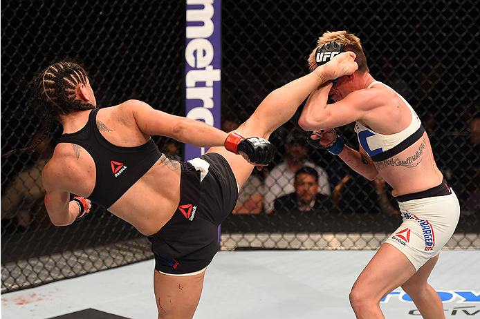 LAS VEGAS, NV - DECEMBER 12: (L-R) Tecia Torres kicks Jocelyn Jones-Lybarger in their women's strawweight bout during the UFC 194 event inside MGM Grand Garden Arena on December 12, 2015 in Las Vegas, Nevada.  (Photo by Josh Hedges/Zuffa LLC/Zuffa LLC via