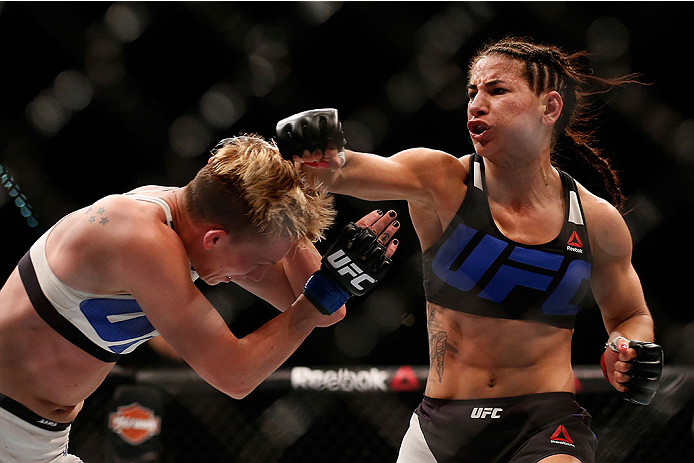 LAS VEGAS, NV - DECEMBER 12: (R-L) Tecia Torres punches Jocelyn Jones-Lybarger in their women's strawweight bout during the UFC 194 event inside MGM Grand Garden Arena on December 12, 2015 in Las Vegas, Nevada. (Photo by Christian Petersen/Zuffa LLC/Zuff