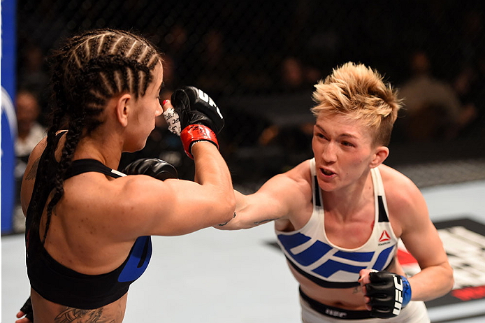 LAS VEGAS, NV - DECEMBER 12: (R) Jocelyn Jones-Lybarger punches Tecia Torres in their women's strawweight bout during the UFC 194 event inside MGM Grand Garden Arena on December 12, 2015 in Las Vegas, Nevada. (Photo by Josh Hedges/Zuffa LLC/Zuffa LLC vi