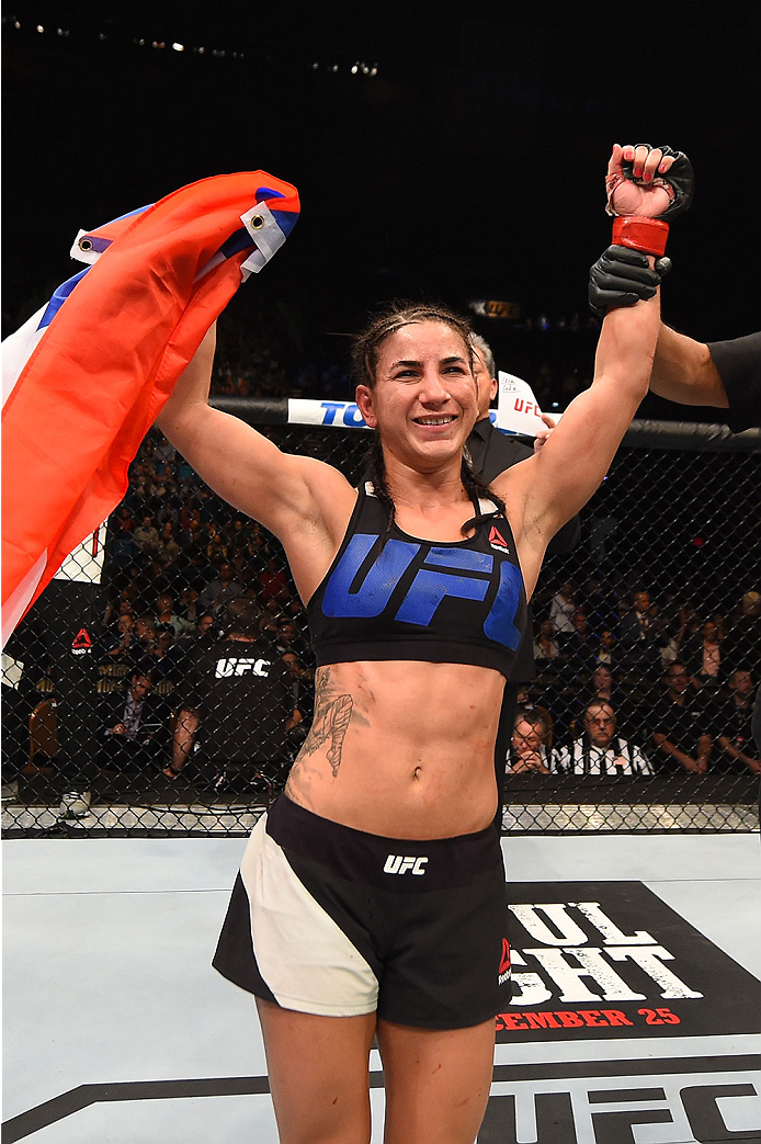 LAS VEGAS, NV - DECEMBER 12: Tecia Torres reacts to her victory over Jocelyn Jones-Lybarger in their women's strawweight bout during the UFC 194 event inside MGM Grand Garden Arena on December 12, 2015 in Las Vegas, Nevada.  (Photo by Josh Hedges/Zuffa LL