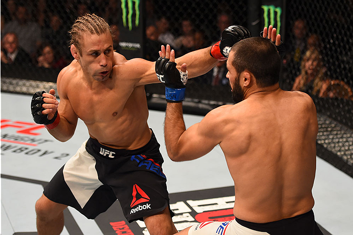 LAS VEGAS, NV - DECEMBER 12: (L-R) Urijah Faber punches Frankie Saenz in their bantamweight bout during the UFC 194 event inside MGM Grand Garden Arena on December 12, 2015 in Las Vegas, Nevada. (Photo by Josh Hedges/Zuffa LLC/Zuffa LLC via Getty Images