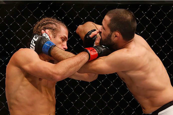 LAS VEGAS, NV - DECEMBER 12: (R-L) Frankie Saenz elbows Urijah Faber in their bantamweight bout during the UFC 194 event inside MGM Grand Garden Arena on December 12, 2015 in Las Vegas, Nevada. (Photo by Christian Petersen/Zuffa LLC/Zuffa LLC via Getty I