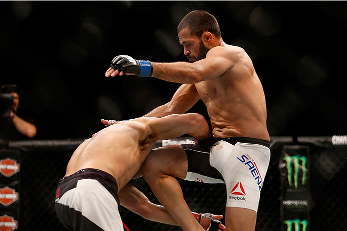 LAS VEGAS, NV - DECEMBER 12: (R-L) Frankie Saenz knees Urijah Faber in their bantamweight bout during the UFC 194 event inside MGM Grand Garden Arena on December 12, 2015 in Las Vegas, Nevada. (Photo by Christian Petersen/Zuffa LLC/Zuffa LLC via Getty Im