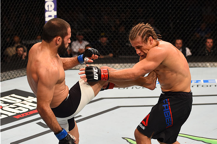 LAS VEGAS, NV - DECEMBER 12: (L-R) Frankie Saenz kicks Urijah Faber in their bantamweight bout during the UFC 194 event inside MGM Grand Garden Arena on December 12, 2015 in Las Vegas, Nevada.  (Photo by Josh Hedges/Zuffa LLC/Zuffa LLC via Getty Images) *