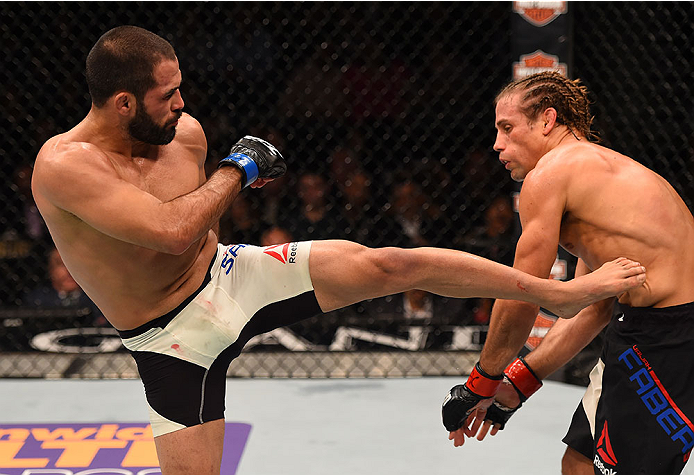 LAS VEGAS, NV - DECEMBER 12: (L-R) Frankie Saenz kicks Urijah Faber in their bantamweight bout during the UFC 194 event inside MGM Grand Garden Arena on December 12, 2015 in Las Vegas, Nevada. (Photo by Josh Hedges/Zuffa LLC/Zuffa LLC via Getty Images) *