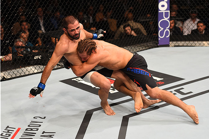 LAS VEGAS, NV - DECEMBER 12: Urijah Faber (right) takes down Frankie Saenz in their bantamweight bout during the UFC 194 event inside MGM Grand Garden Arena on December 12, 2015 in Las Vegas, Nevada. (Photo by Josh Hedges/Zuffa LLC/Zuffa LLC via Getty Im