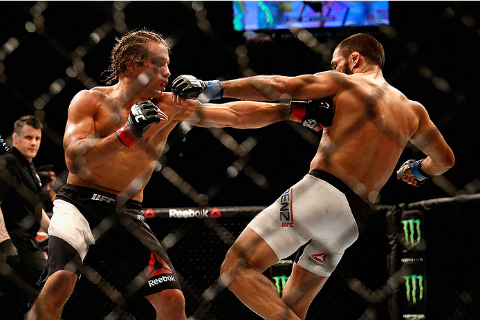 LAS VEGAS, NV - DECEMBER 12: Urijah Faber (left) punches Frankie Saenz in their bantamweight bout during the UFC 194 event inside MGM Grand Garden Arena on December 12, 2015 in Las Vegas, Nevada. (Photo by Christian Petersen/Zuffa LLC/Zuffa LLC via Getty