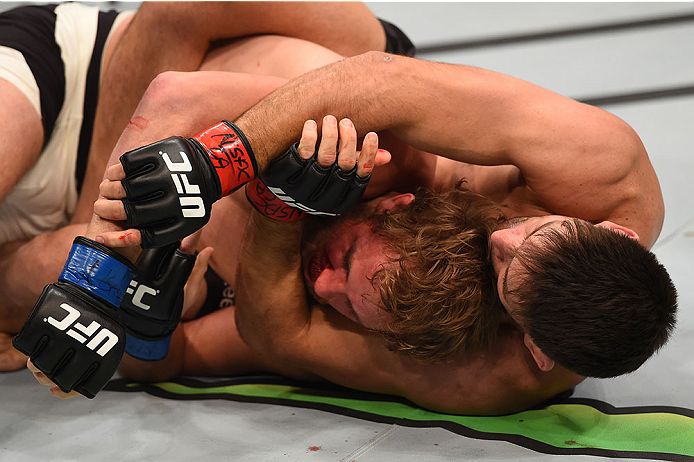 LAS VEGAS, NV - DECEMBER 12: (R-L) Demian Maia of Brazil attempts to submit Gunnar Nelson of Iceland in their welterweight bout during the UFC 194 event inside MGM Grand Garden Arena on December 12, 2015 in Las Vegas, Nevada. (Photo by Josh Hedges/Zuffa