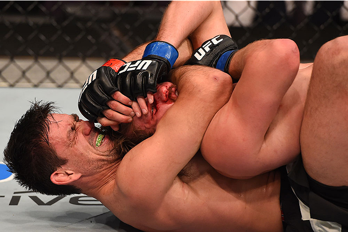 LAS VEGAS, NV - DECEMBER 12: Demian Maia of Brazil (bottom) attempts to submit Gunnar Nelson of Iceland in their welterweight bout during the UFC 194 event inside MGM Grand Garden Arena on December 12, 2015 in Las Vegas, Nevada. (Photo by Josh Hedges/Zuf