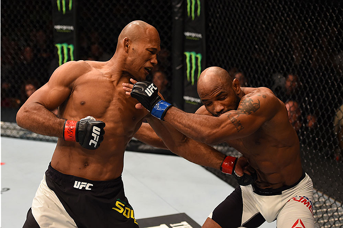 LAS VEGAS, NV - DECEMBER 12: (L-R) Ronaldo 'Jacare' Souza of Brazil punches Yoel Romero of Cuba in their middleweight bout during the UFC 194 event inside MGM Grand Garden Arena on December 12, 2015 in Las Vegas, Nevada.  (Photo by Josh Hedges/Zuffa LLC/Z