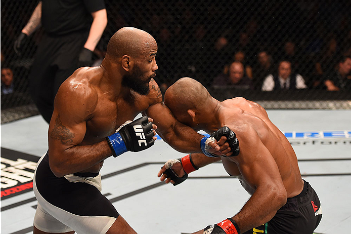 LAS VEGAS, NV - DECEMBER 12: (L-R) Yoel Romero of Cuba punches Ronaldo 'Jacare' Souza of Brazil in their middleweight bout during the UFC 194 event inside MGM Grand Garden Arena on December 12, 2015 in Las Vegas, Nevada.  (Photo by Josh Hedges/Zuffa LLC/Z