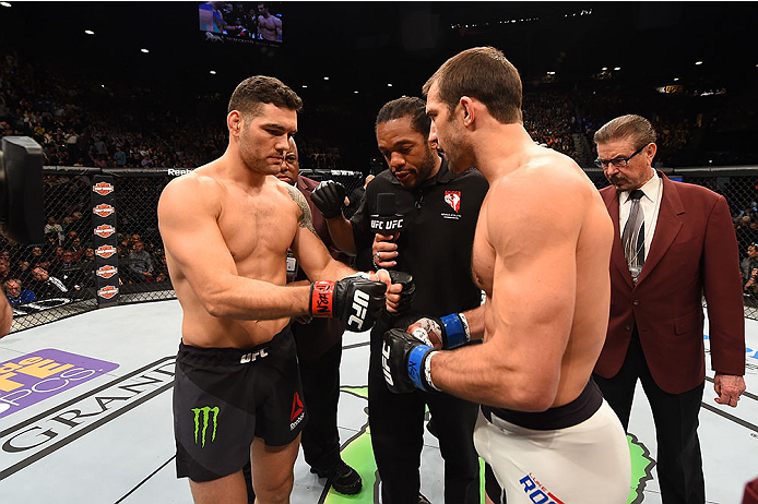 LAS VEGAS, NV - DECEMBER 12: (L-R) Chris Weidman and Luke Rockhold touch gloves in their UFC middleweight championship bout during the UFC 194 event inside MGM Grand Garden Arena on December 12, 2015 in Las Vegas, Nevada.  (Photo by Josh Hedges/Zuffa LLC/