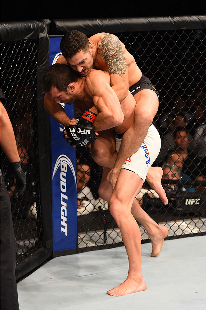 LAS VEGAS, NV - DECEMBER 12: Chris Weidman (top) attempts to submit Luke Rockhold in their UFC middleweight championship bout during the UFC 194 event inside MGM Grand Garden Arena on December 12, 2015 in Las Vegas, Nevada.  (Photo by Josh Hedges/Zuffa LL