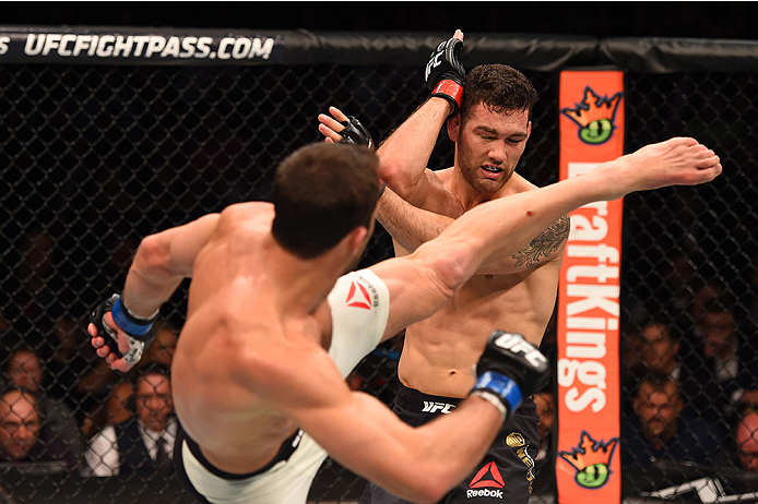 LAS VEGAS, NV - DECEMBER 12: (L-R) Luke Rockhold kicks Chris Weidman in their UFC middleweight championship bout during the UFC 194 event inside MGM Grand Garden Arena on December 12, 2015 in Las Vegas, Nevada.  (Photo by Josh Hedges/Zuffa LLC/Zuffa LLC v