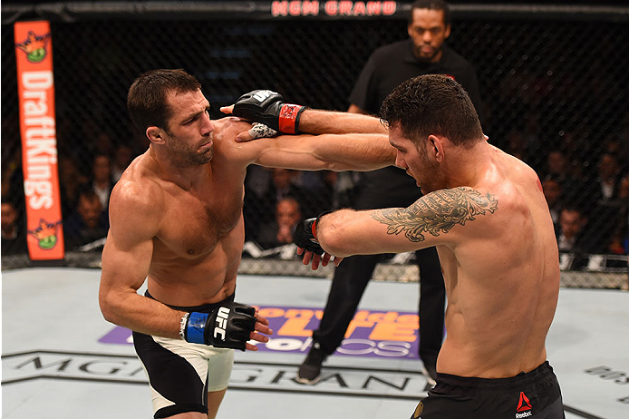 LAS VEGAS, NV - DECEMBER 12: (L-R) Luke Rockhold punches Chris Weidman in their UFC middleweight championship bout during the UFC 194 event inside MGM Grand Garden Arena on December 12, 2015 in Las Vegas, Nevada. (Photo by Josh Hedges/Zuffa LLC/Zuffa LLC