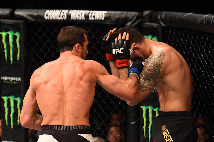 LAS VEGAS, NV - DECEMBER 12: (L-R) Luke Rockhold punches Chris Weidman in their UFC middleweight championship bout during the UFC 194 event inside MGM Grand Garden Arena on December 12, 2015 in Las Vegas, Nevada.  (Photo by Josh Hedges/Zuffa LLC/Zuffa LLC