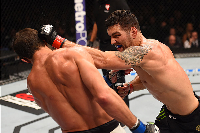 LAS VEGAS, NV - DECEMBER 12: (R-L) Chris Weidman punches Luke Rockhold in their UFC middleweight championship bout during the UFC 194 event inside MGM Grand Garden Arena on December 12, 2015 in Las Vegas, Nevada. (Photo by Josh Hedges/Zuffa LLC/Zuffa LLC
