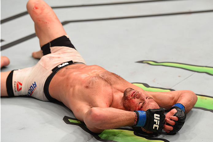 LAS VEGAS, NV - DECEMBER 12: Luke Rockhold reacts to his victory over Chris Weidman in their UFC middleweight championship bout during the UFC 194 event inside MGM Grand Garden Arena on December 12, 2015 in Las Vegas, Nevada. (Photo by Josh Hedges/Zuffa