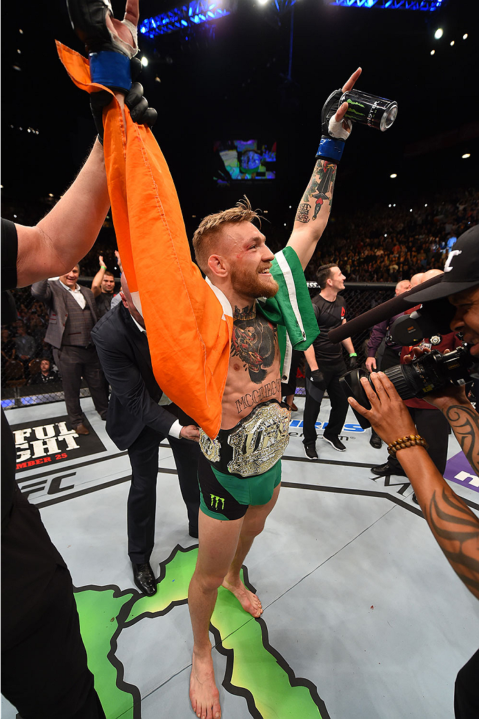 LAS VEGAS, NV - DECEMBER 12:  Conor McGregor of Ireland reacts to his victory over Jose Aldo of Brazil in their UFC featherweight championship bout during the UFC 194 event inside MGM Grand Garden Arena on December 12, 2015 in Las Vegas, Nevada.  (Photo b