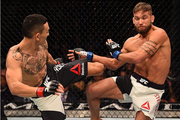 LAS VEGAS, NV - DECEMBER 12: (L-R) Max Holloway kicks Jeremy Stephens in their featherweight bout during the UFC 194 event inside MGM Grand Garden Arena on December 12, 2015 in Las Vegas, Nevada.  (Photo by Josh Hedges/Zuffa LLC/Zuffa LLC via Getty Images