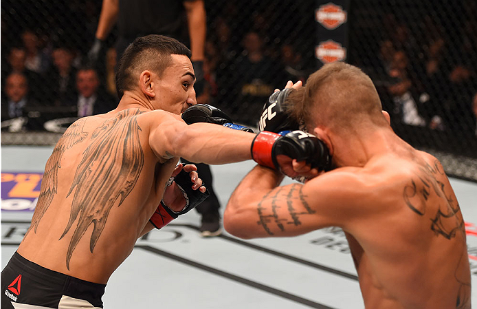 LAS VEGAS, NV - DECEMBER 12: (L-R) Max Holloway punches Jeremy Stephens in their featherweight bout during the UFC 194 event inside MGM Grand Garden Arena on December 12, 2015 in Las Vegas, Nevada.  (Photo by Josh Hedges/Zuffa LLC/Zuffa LLC via Getty Imag