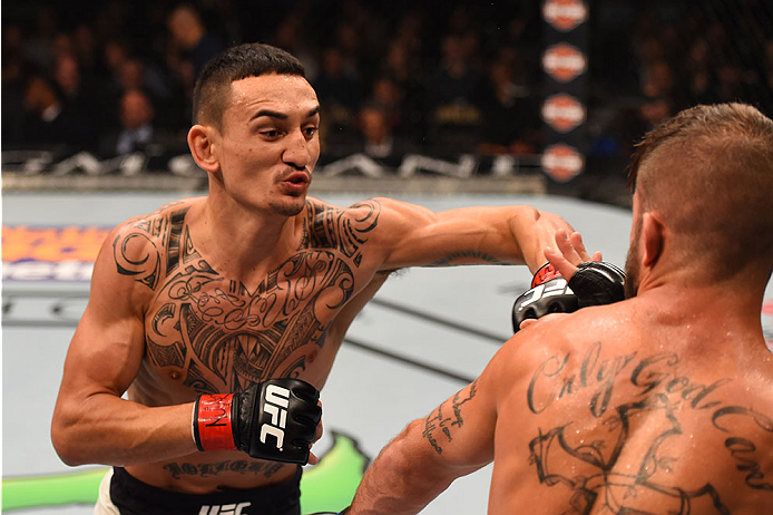 LAS VEGAS, NV - DECEMBER 12: (L-R) Max Holloway punches Jeremy Stephens in their featherweight bout during the UFC 194 event inside MGM Grand Garden Arena on December 12, 2015 in Las Vegas, Nevada.  (Photo by Josh Hedges/Zuffa LLC/Zuffa LLC via Getty Imag