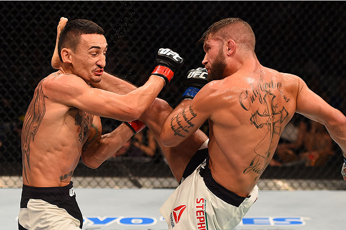 LAS VEGAS, NV - DECEMBER 12: (R-L) Jeremy Stephens kicks Max Holloway in their featherweight bout during the UFC 194 event inside MGM Grand Garden Arena on December 12, 2015 in Las Vegas, Nevada.  (Photo by Josh Hedges/Zuffa LLC/Zuffa LLC via Getty Images