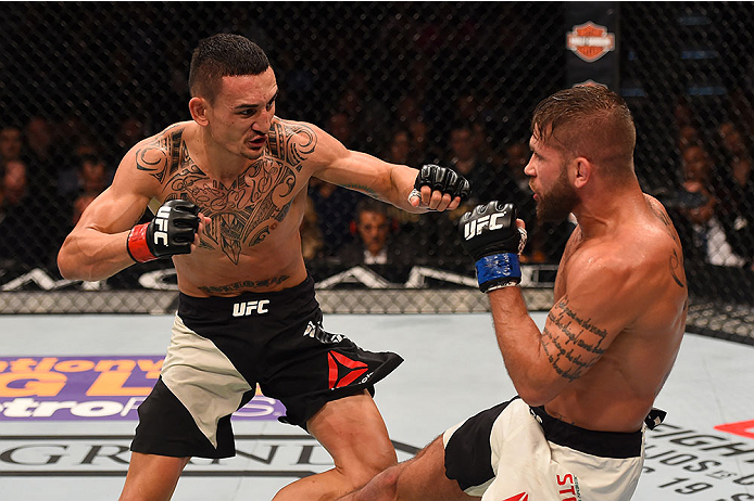 LAS VEGAS, NV - DECEMBER 12: (R-L) Jeremy Stephens kicks Max Holloway in their featherweight bout during the UFC 194 event inside MGM Grand Garden Arena on December 12, 2015 in Las Vegas, Nevada.  (Photo by Josh Hedges/Zuffa LLC/Zuffa LLC via Getty Images