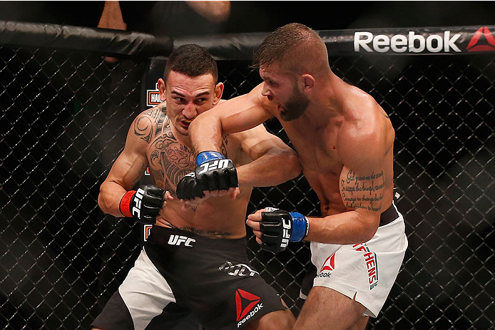 LAS VEGAS, NV - DECEMBER 12: (R-L) Jeremy Stephens punches Max Holloway in their featherweight bout during the UFC 194 event inside MGM Grand Garden Arena on December 12, 2015 in Las Vegas, Nevada.  (Photo by Christian Petersen/Zuffa LLC/Zuffa LLC via Get