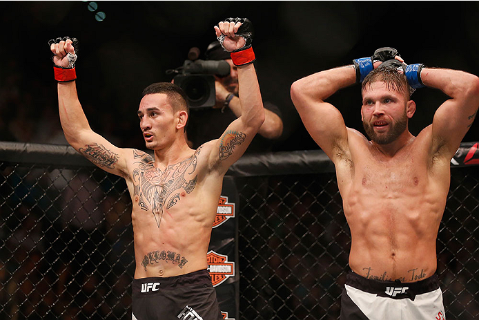 LAS VEGAS, NV - DECEMBER 12: (L-R) Max Holloway and Jeremy Stephens react after their featherweight bout during the UFC 194 event inside MGM Grand Garden Arena on December 12, 2015 in Las Vegas, Nevada.  (Photo by Christian Petersen/Zuffa LLC/Zuffa LLC vi