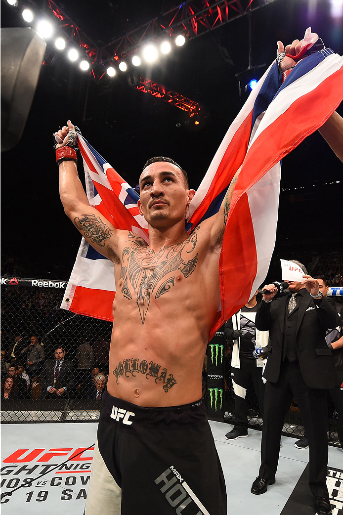 LAS VEGAS, NV - DECEMBER 12: Max Holloway reacts to being declared the winner against Jeremy Stephens in their featherweight bout during the UFC 194 event inside MGM Grand Garden Arena on December 12, 2015 in Las Vegas, Nevada.  (Photo by Josh Hedges/Zuff